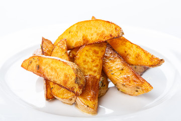 Crispy baked potato wedges closeup
