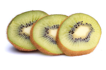 slices of ripe kiwi with mint leaves on a white background