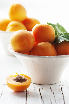 Fresh sweet apricots on the wooden table