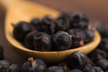 Juniper berries on a wooden background