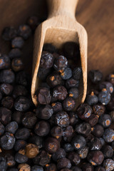 Juniper berries on a wooden background