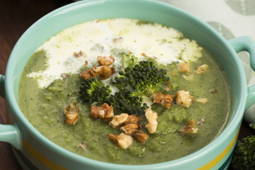Broccoli cream soup on table