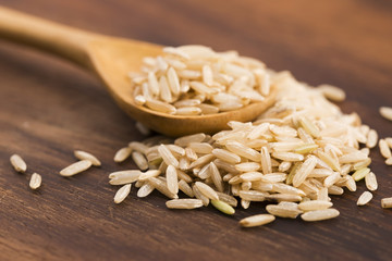 Spoon of brown rice close up