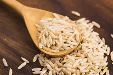 Spoon of brown rice close up