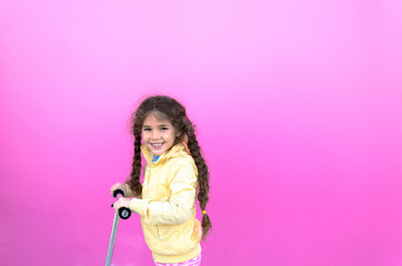 Little girl and her scooter