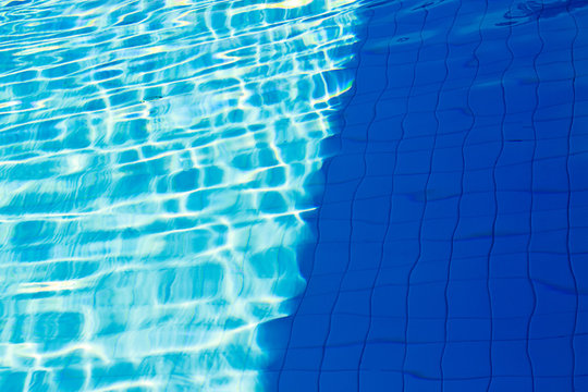 abstract of sun reflected in the water of the swimming pool : Bl