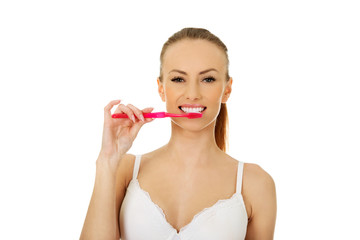 Beautiful woman with toothbrush.