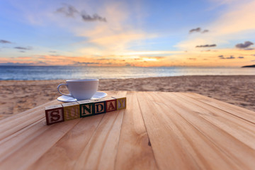 Text wood block and coffee cup on wood table