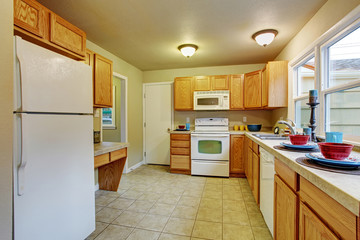 Authentic kitchen with tile floor.
