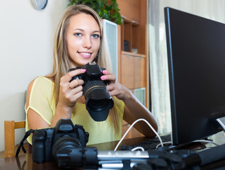 Female photographer in front of laptop