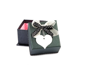 Black gift box with white heart price tag