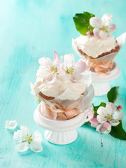 Fototapeta na wymiar Cupcake or muffin with fresh flower