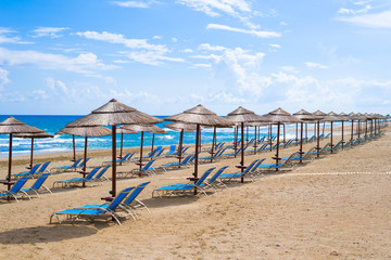 Empty sun chairs on the beach, selective focus and colors