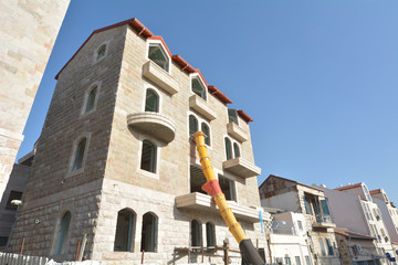 Fototapeta na wymiar Jerusalem stone facade on Restored building in Jerusalem, Israel