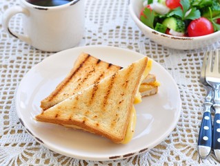 cheese sandwich with salad and coffee. breakfast