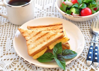 cheese sandwich with salad and coffee. breakfast
