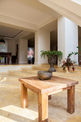 Wooden table in designed interior
