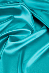 Blue silk cloth texture close up.