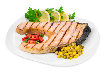 Grilled salmon steak with vegetables.