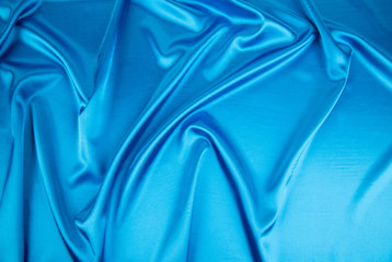 Some soft folds of blue silk cloth.