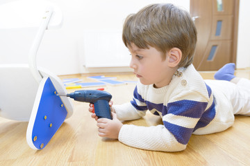 Little Boy using diy tool