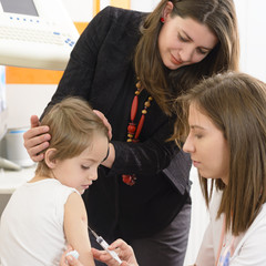 Boy being injected at clinic