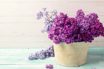 Background with  lilac flowers in bowl