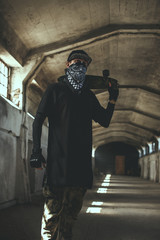 Guy in gangster clothing and face mask