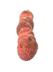 Ripe lychee fruits over white background