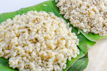 Red ant egg on banana leaf.
