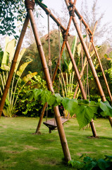Fototapeta premium Bamboo swings in tropical garden
