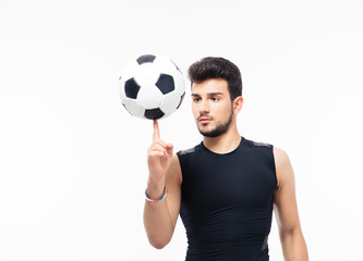 Soccer player spinning ball on his finger