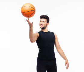 Basketball player spinning ball on his finger