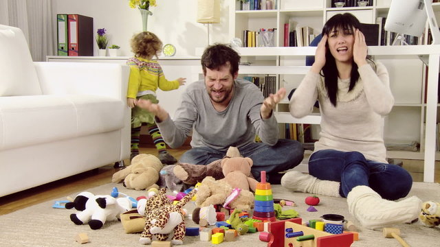 Husband and wife screaming about mess in living room created by daughter