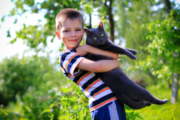 young boy with a pet cat
