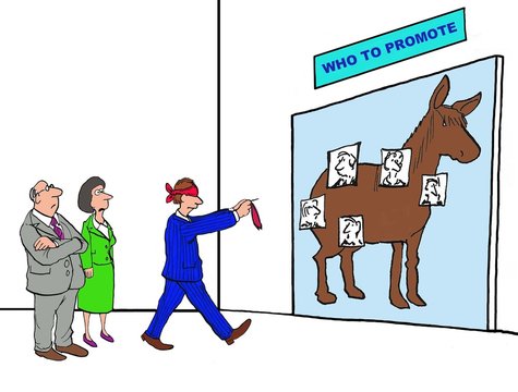 Business cartoon of blindfolded businessman playing the pin the tail on the donkey game, only it has been changed to 'who to promote'.