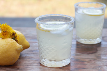 Glass of freshly prepared, cold and refreshing lemonade.