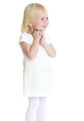 Cute little blonde girl short white dress