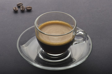 Cup of coffee on the black background