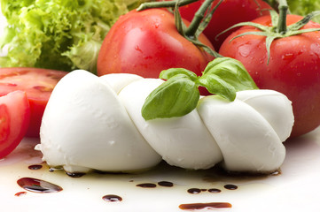 Mozzarella tomatoes and fresh salad on the white © Orlando Bellini