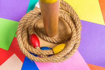 Ring Toss Game on Wood Background