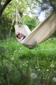 Girl relaxing in hammock