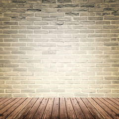 Old interior room with brick wall and wood floor
