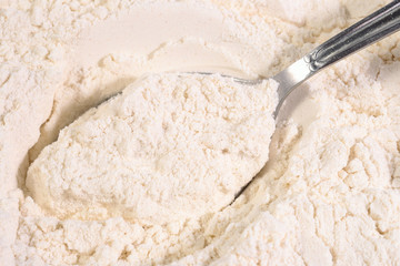White flour in a spoon