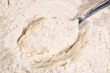 White flour in a spoon