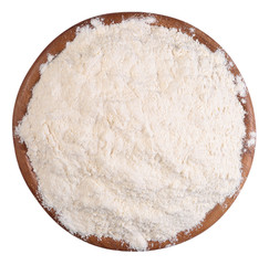 White flour in a wooden bowl on a white