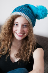 casual teenage girl wearing a hat