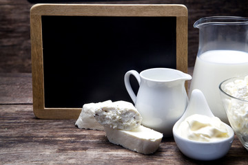 Milk and Camembert cheese with blackboard