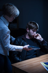 Policewoman getting testimony from suspect