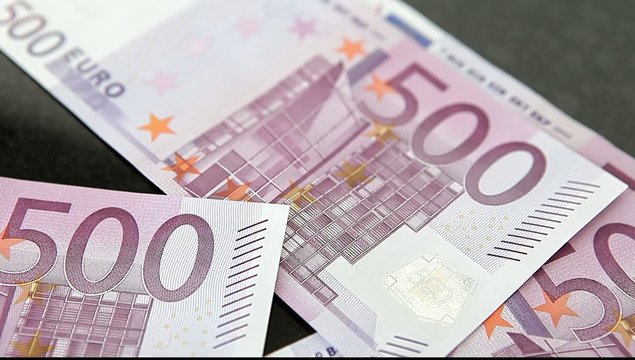 100 and 500 Euro Banknotes on dark background
